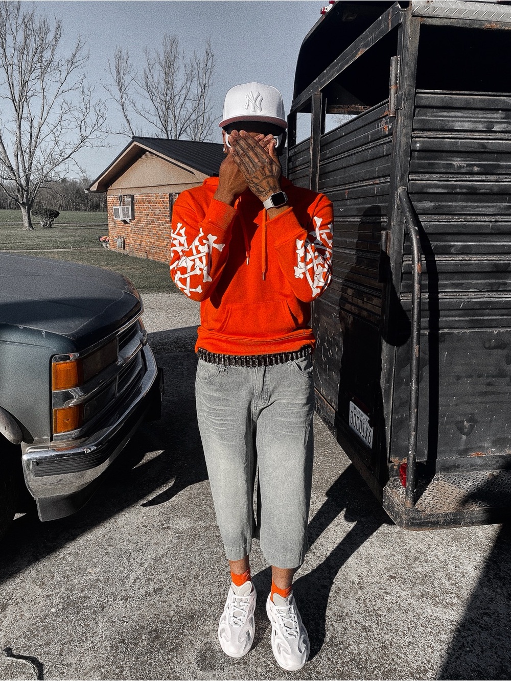 AMIRI Bright Orange Crewneck Sweater with White Sleeve Graphics